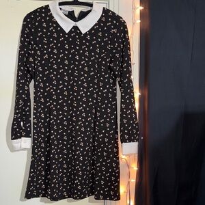 Spirit Black Dress with Floral Pattern and White Accents
